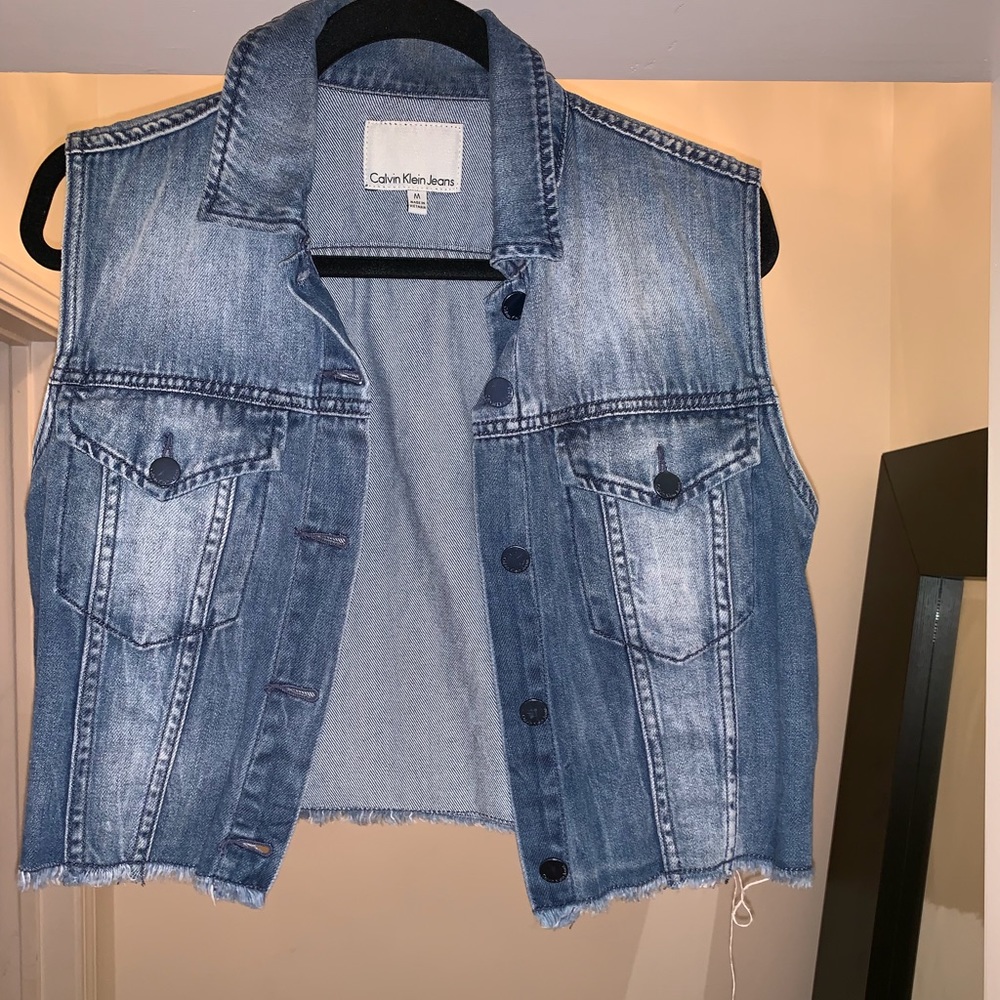 Distressed denim vest by Calvin Klein
